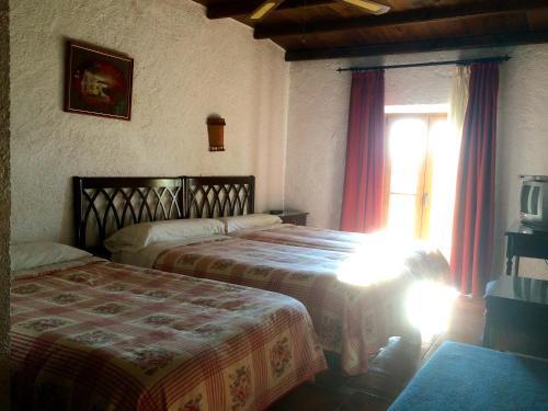 Foto de una habitación de Hotel Rural El Cortijo