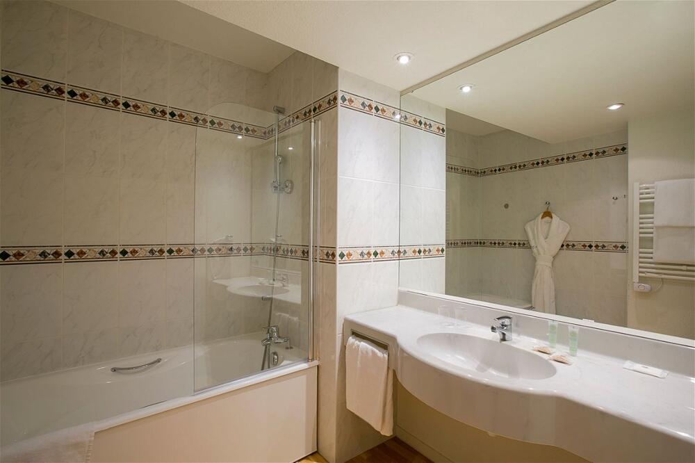 Foto del baño de Hotel Best Western Sourceo