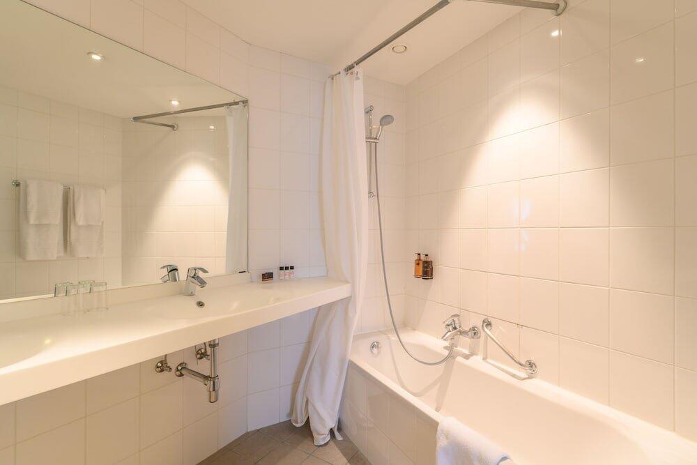 Foto del baño de Alma Grand Place Hotel