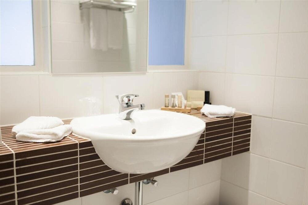 Foto del baño de Progress Hotel