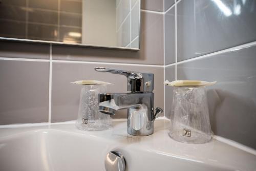 Foto del baño de Carline Hotel