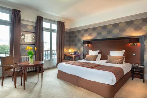 Foto de una habitación de Le Grand Hotel