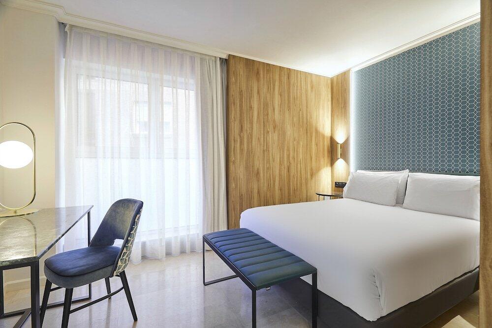 Foto de una habitación de Hotel Exe Mitre