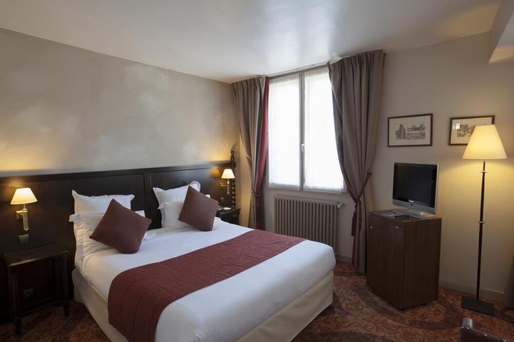 Foto de una habitación de Hôtel Le Donjon - Cœur de La Cité Médiévale
