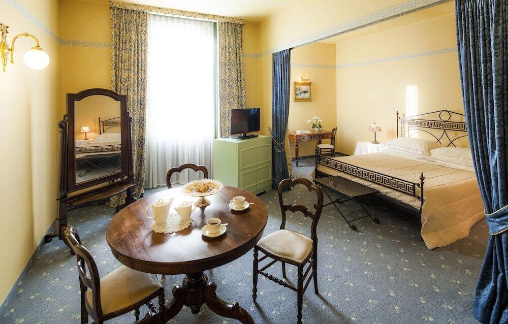 Foto de una habitación de Cosmo Hotel Torri