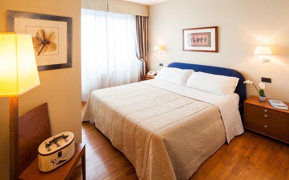 Foto de una habitación de Cosmo Hotel Torri