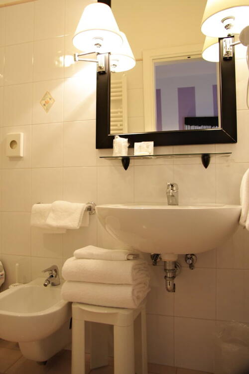 Foto del baño de Hotel Alex