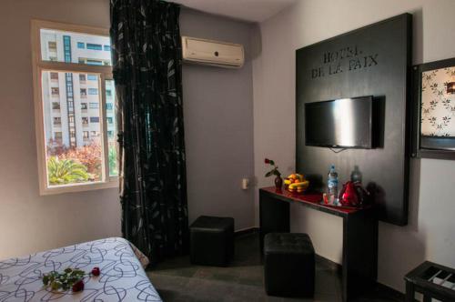 Foto de una habitación de Hotel De La Paix