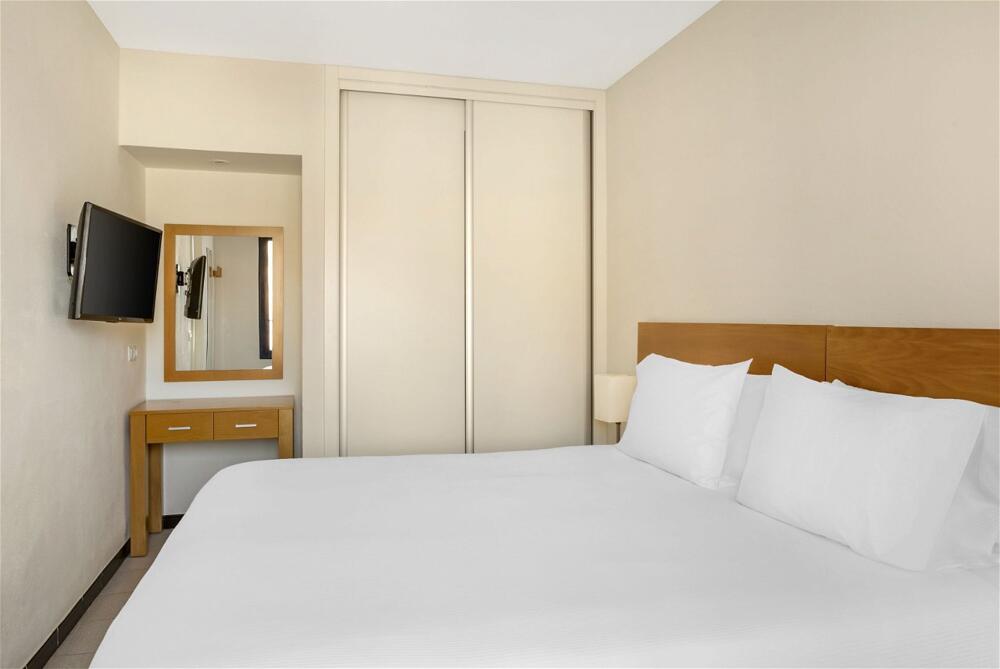 Foto de una habitación de Aparthotel Club Cala Blanca