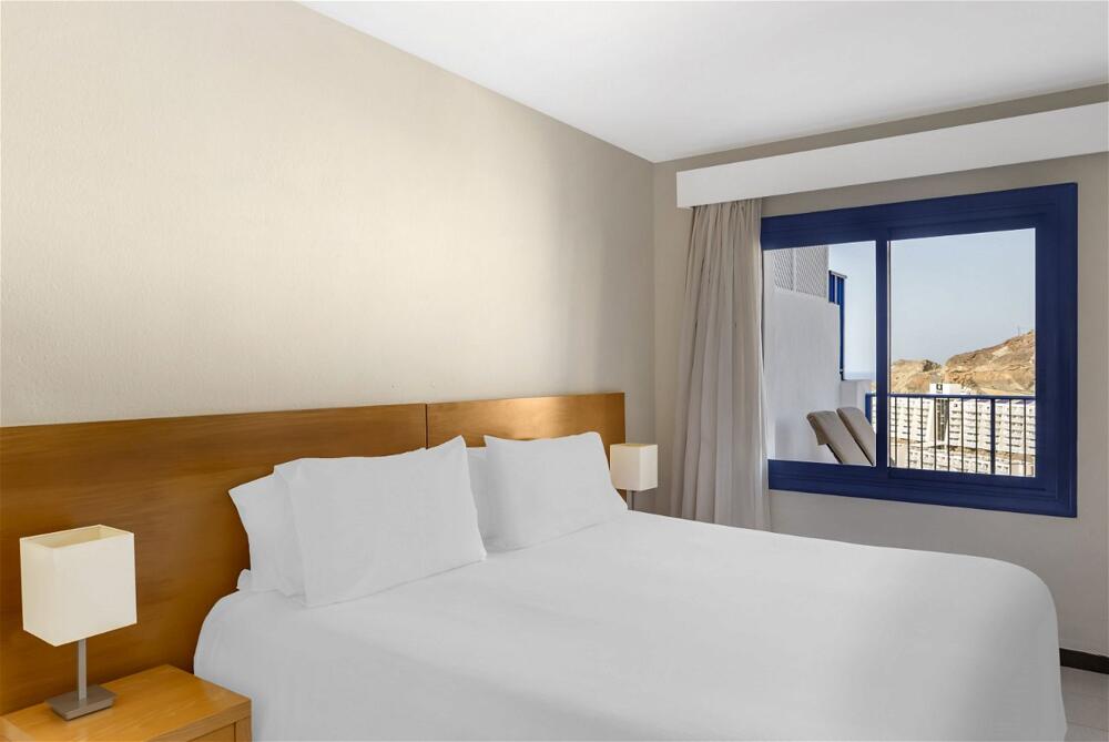 Foto de una habitación de Aparthotel Club Cala Blanca