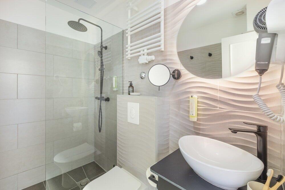 Foto del baño de Novum Hotel Lichtburg am Kurfürstendamm