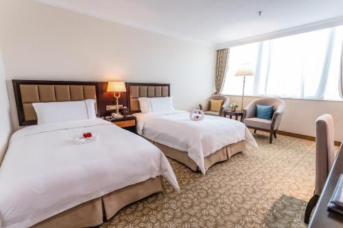 Foto de una habitación de Hotel China Mayors Plaza