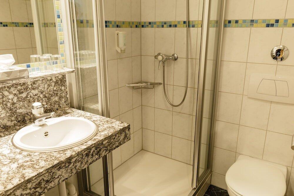 Foto del baño de Hotel Arenas Resort Victoria-Lauberhorn