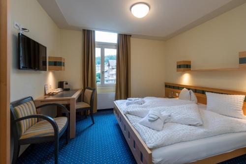 Foto de una habitación de Hotel Arenas Resort Victoria-Lauberhorn