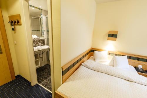 Foto de una habitación de Hotel Arenas Resort Victoria-Lauberhorn