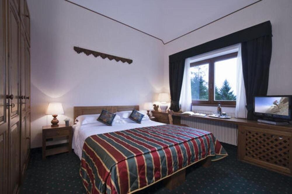 Foto de una habitación de Boutique Hotel Villa Blu Cortina D&amp;#039;Ampezzo