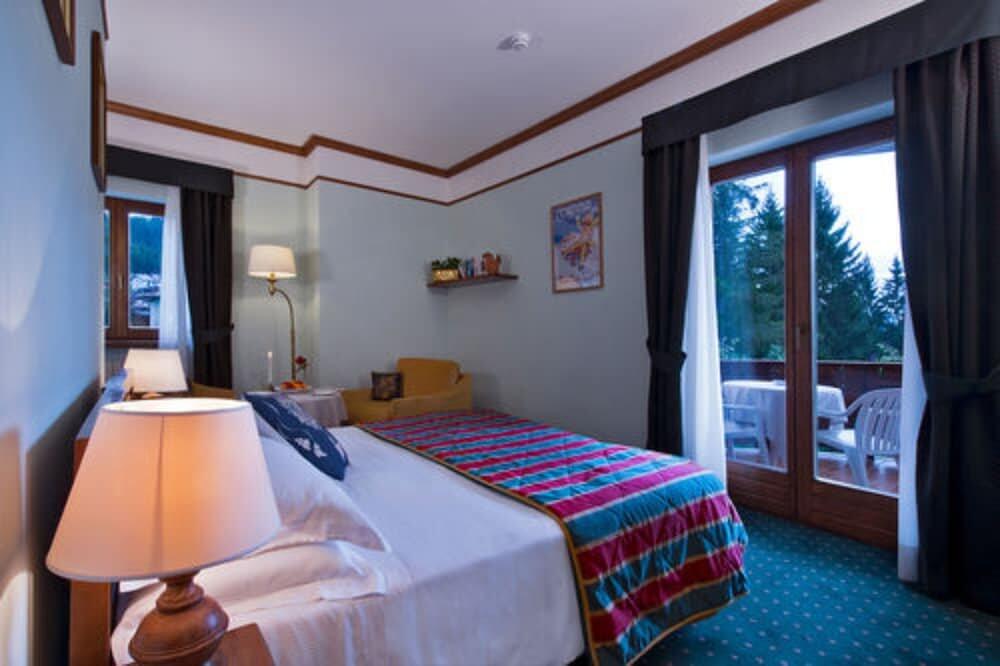 Foto de una habitación de Boutique Hotel Villa Blu Cortina D&amp;#039;Ampezzo