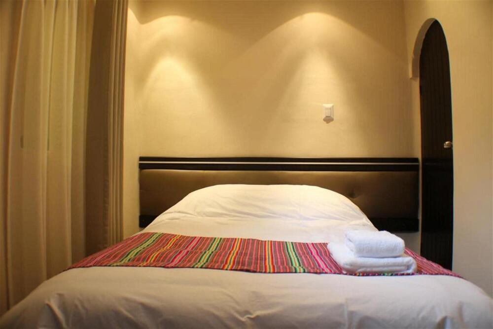 Foto de una habitación de Tampu Hotel