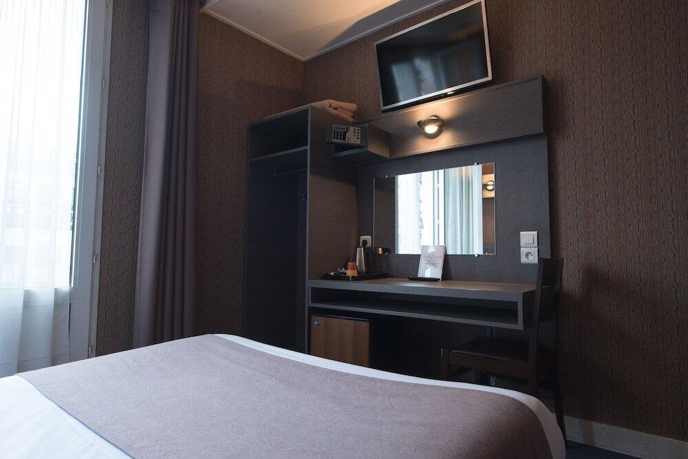 Foto de una habitación de Hotel Home Latin