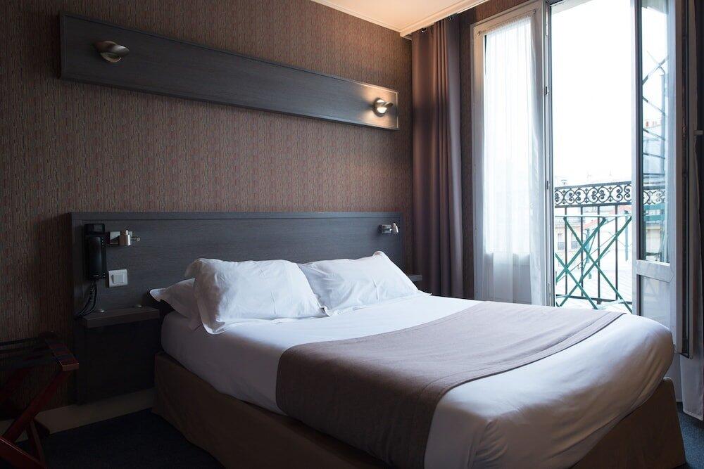 Foto de una habitación de Hotel Home Latin