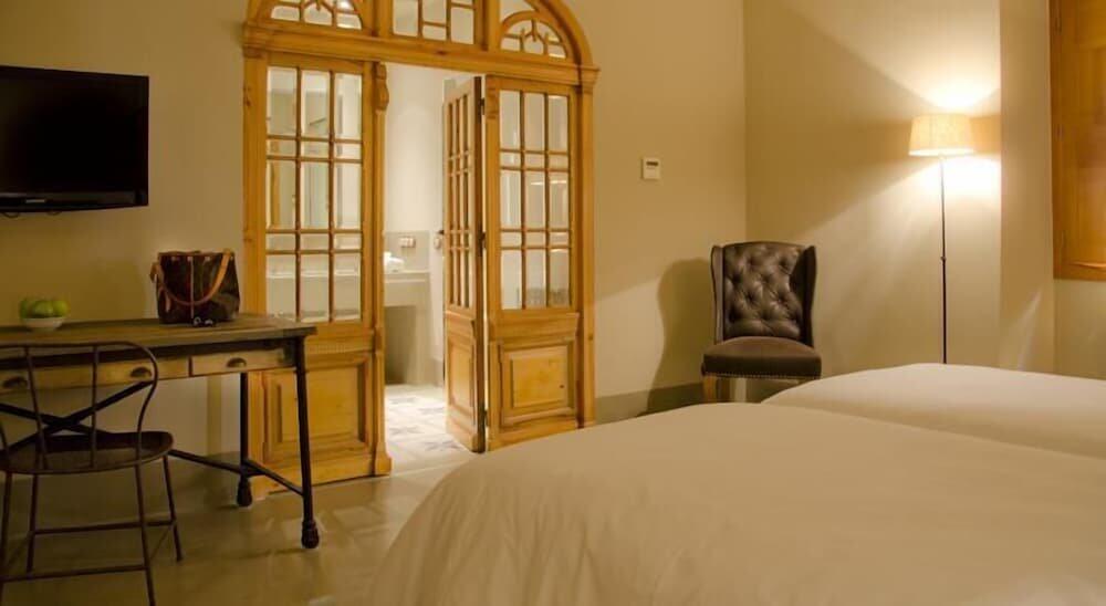 Foto de una habitación de Hotel Palacio Carvajal Girón