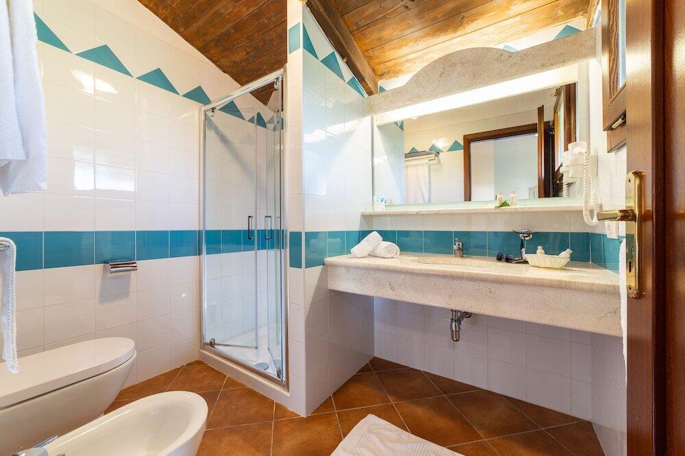 Foto del baño de TH San Teodoro - Liscia Eldi Village