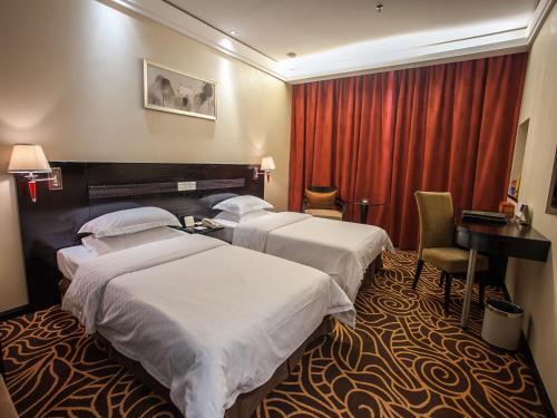 Foto de una habitación de Hua Shi Hotel