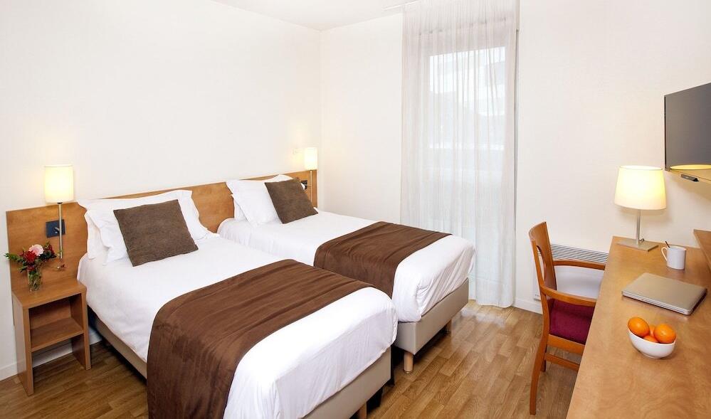 Foto de una habitación de Aparthotel Séjours &amp;amp; Affaires Rennes Longs Champs