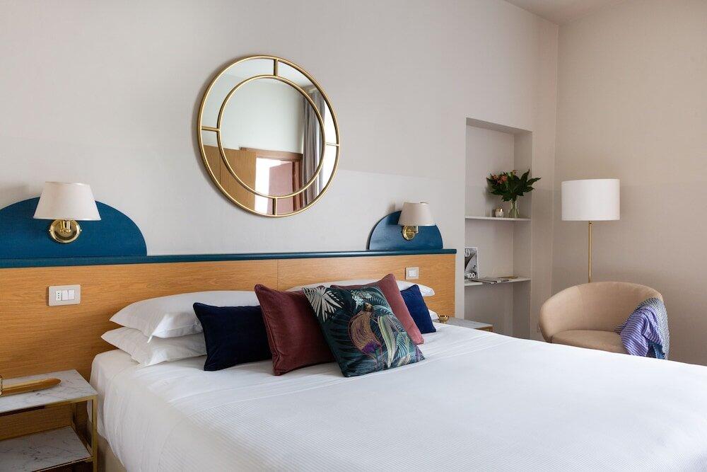 Foto de una habitación de Aramis Rooms