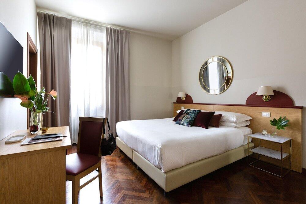 Foto de una habitación de Aramis Rooms