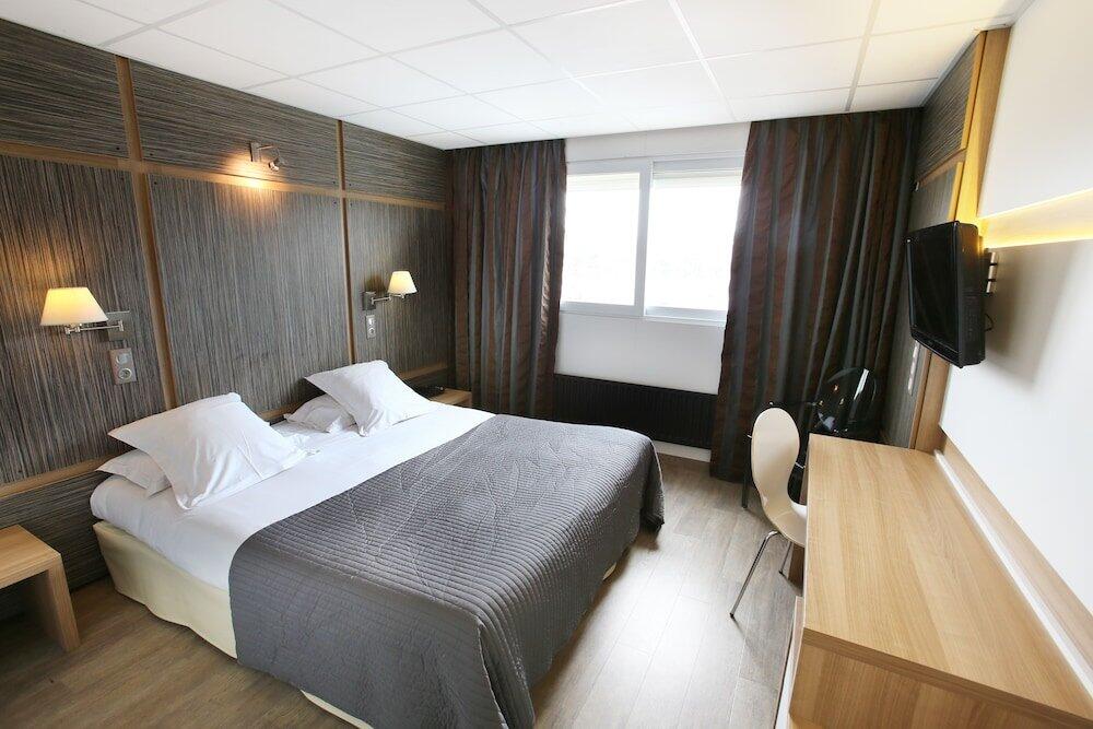Foto de una habitación de The Originals Boutique, Hôtel Neptune, Montpellier Sud (Inter-Hotel)