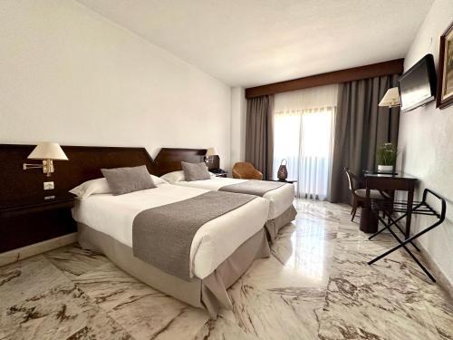 Foto de una habitación de Hotel Turia