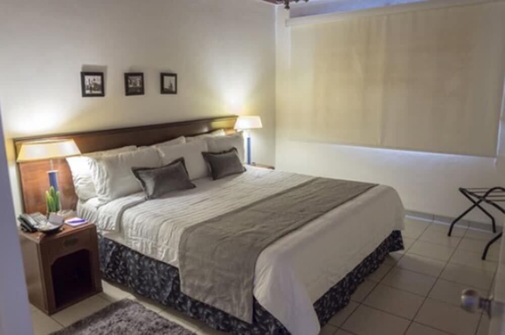 Foto de una habitación de Aparthotel Terranova Suites