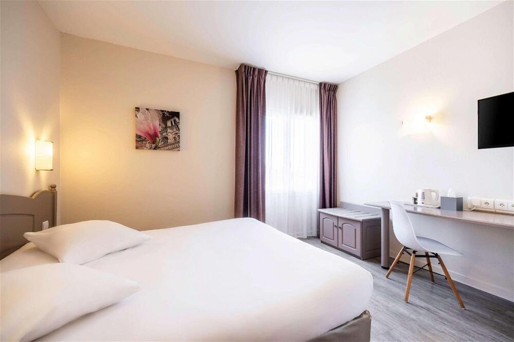 Foto de una habitación de Comfort Hotel Saintes