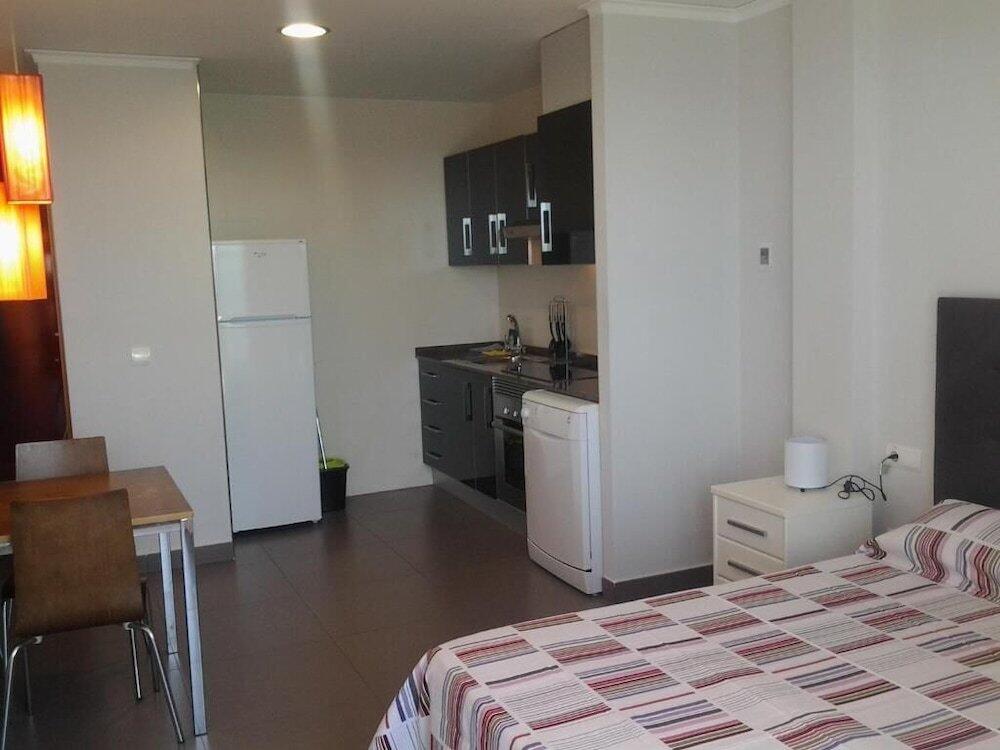 Foto de una habitación de Aparthotel El Faro