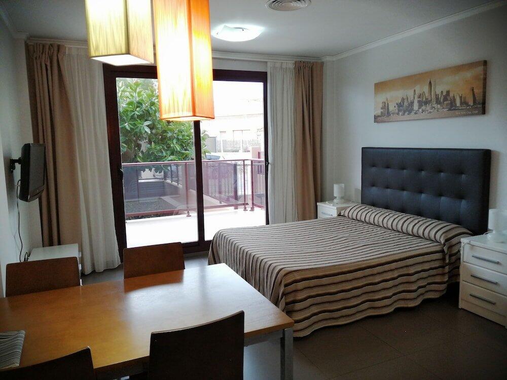 Foto de una habitación de Aparthotel El Faro