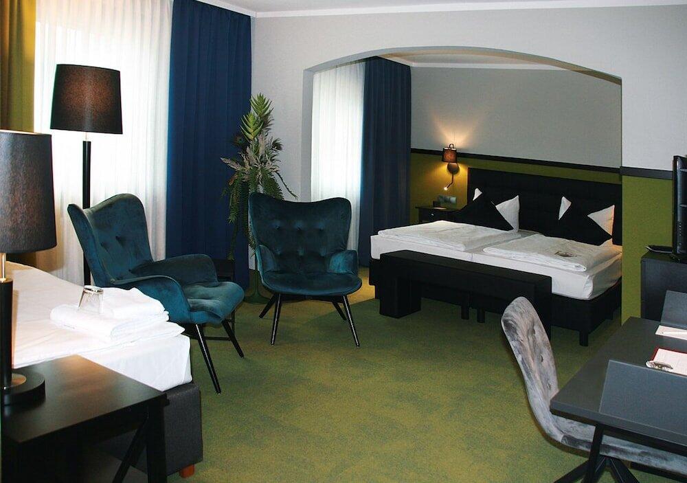 Foto de una habitación de AVIA Hotel