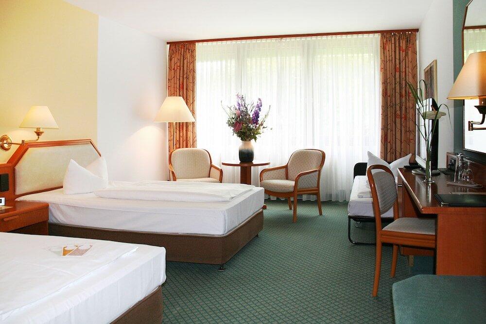 Foto de una habitación de AVIA Hotel