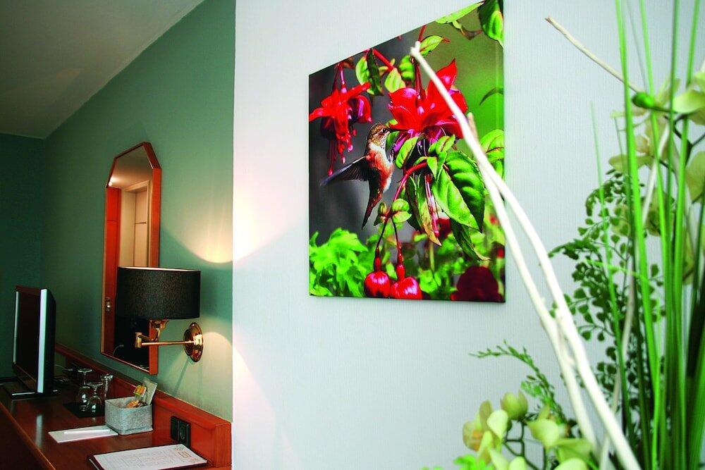 Foto de una habitación de AVIA Hotel