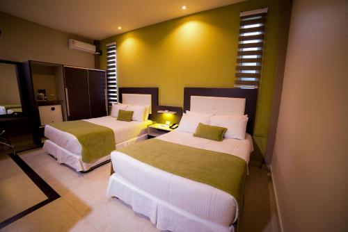 Foto de una habitación de Hotel Camino Plaza