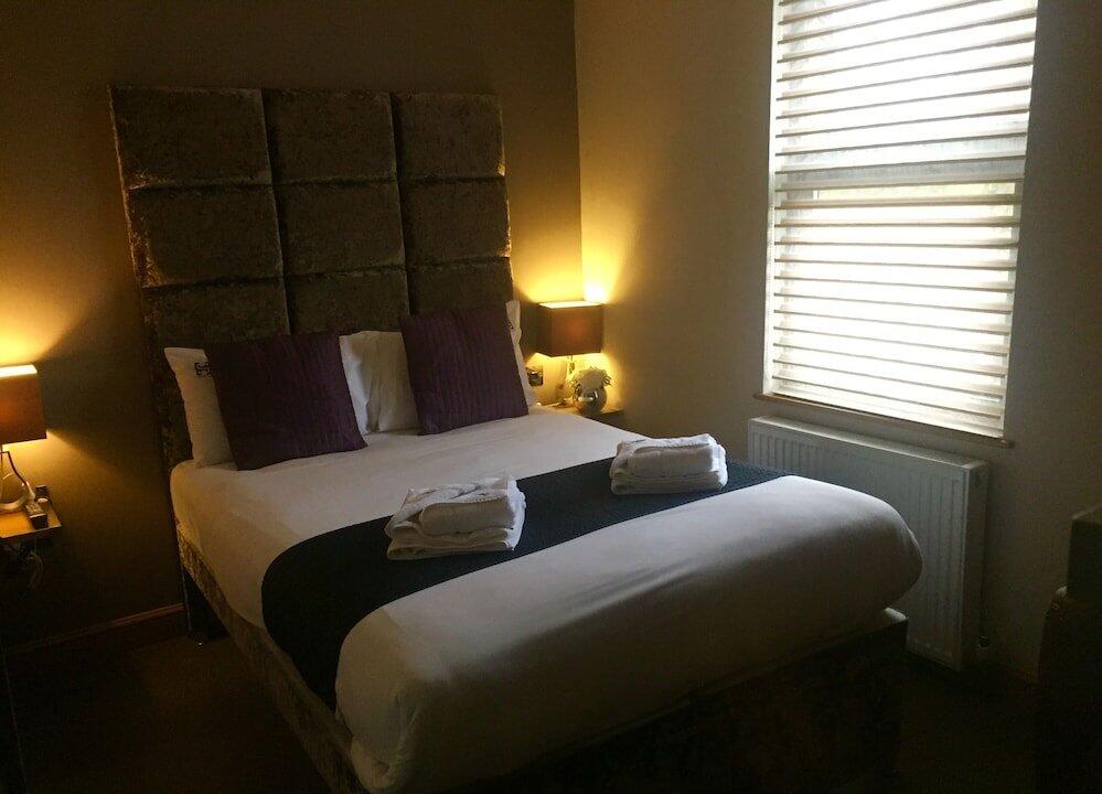 Foto de una habitación de Homestay Hotel