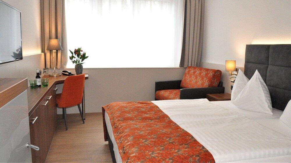 Foto de una habitación de Stadtoase Kolping Hotel