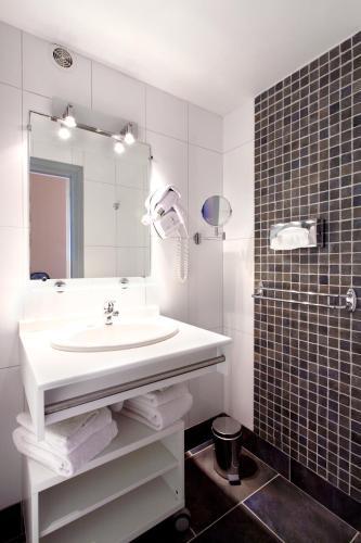 Foto del baño de Hotel Château Corneille