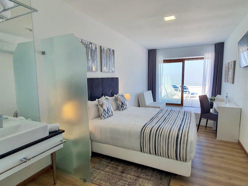 Foto de una habitación de Miramar Hotel Spa &amp;amp; Apartments