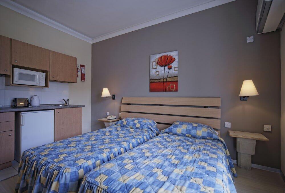 Foto de una habitación de Porto Azzurro Aparthotel
