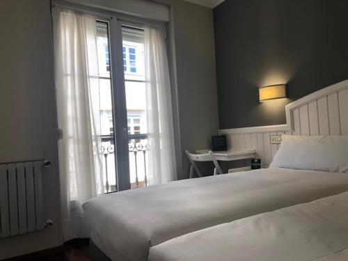 Foto de una habitación de Albergue Alda Miramar Rooms