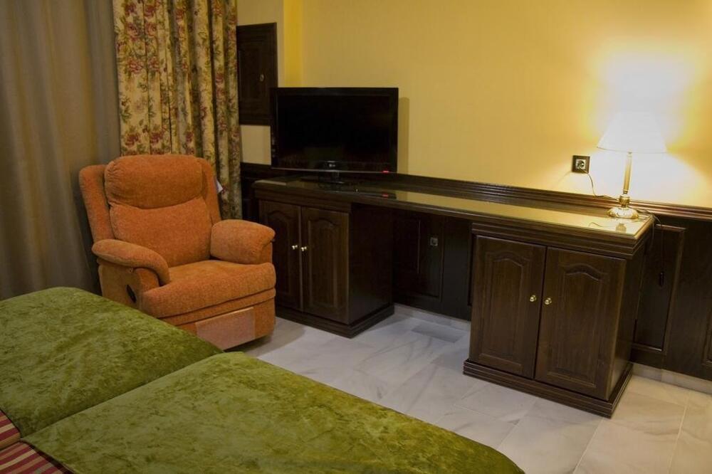 Foto de una habitación de Hotel Las Acacias