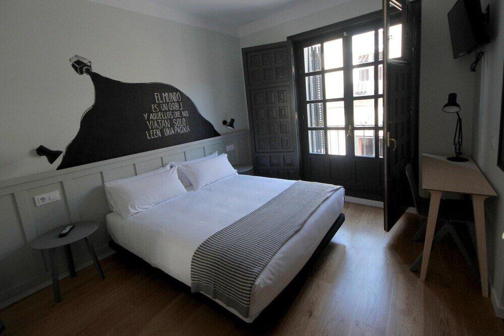 Foto de una habitación de Complutum Hostel