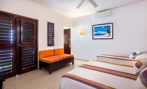 Foto de una habitación de Villas El Encanto Cozumel