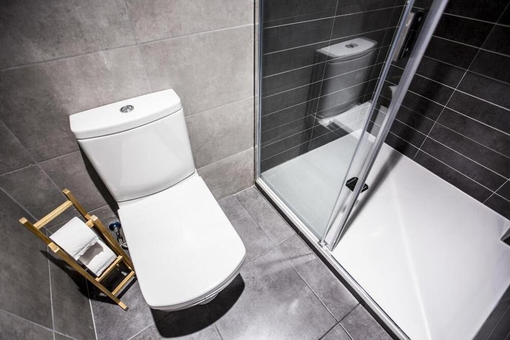 Foto del baño de Albergue Hola Rooms
